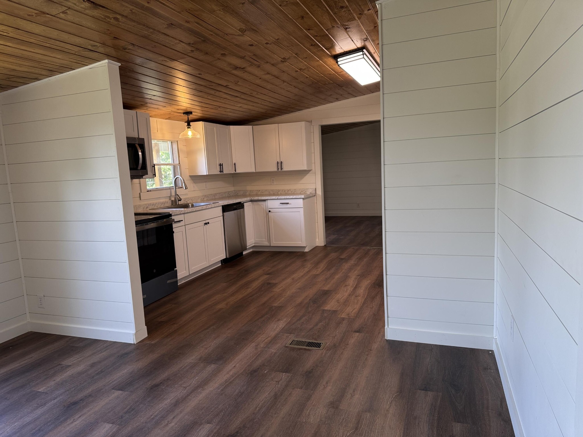 675 Ware Lane Georgetown, TN 37336 - Photo 14 of 24 a kitchen with granite countertop white cabinets and wooden floor