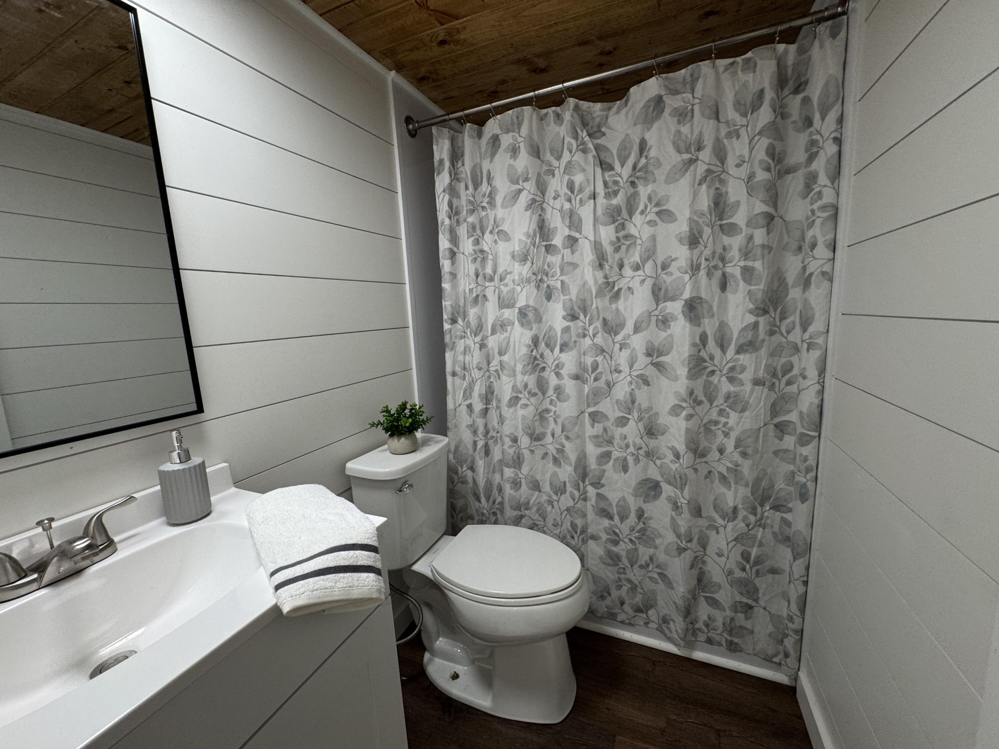 675 Ware Lane Georgetown, TN 37336 - Photo 21 of 24 a bathroom with a toilet and a shower curtain