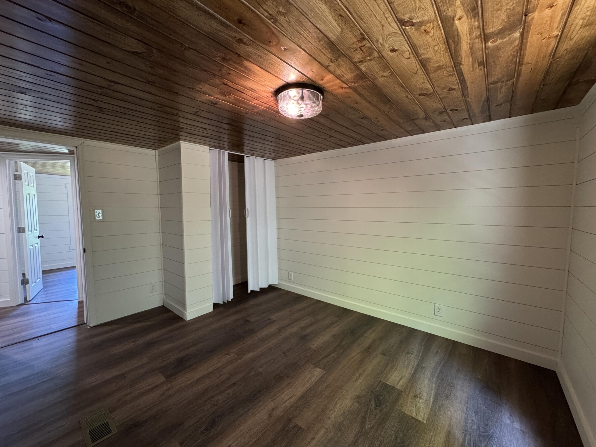 675 Ware Lane Georgetown, TN 37336 - Photo 23 of 24 a view of an empty room with wooden floor and a window