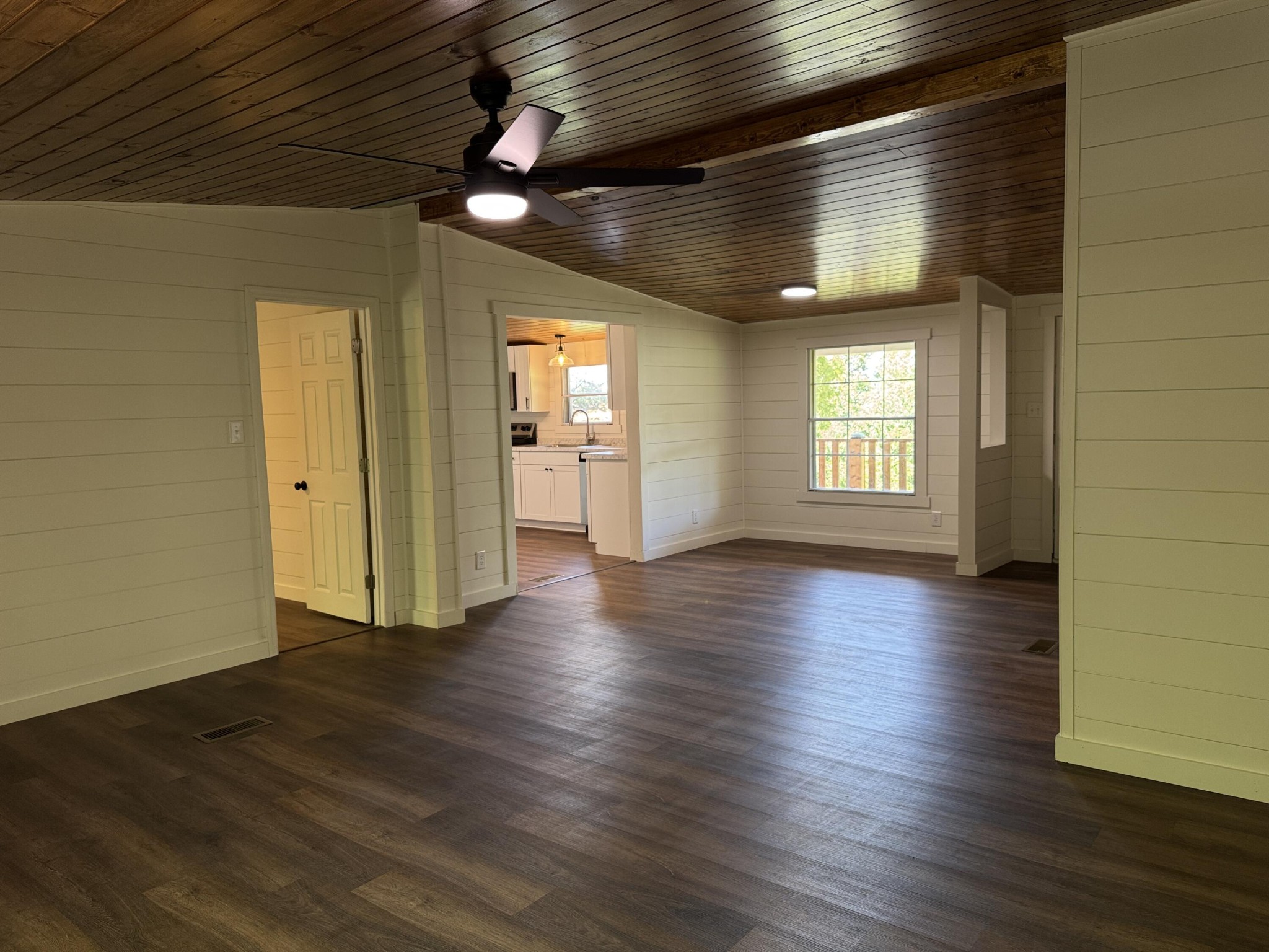 675 Ware Lane Georgetown, TN 37336 - Photo 9 of 24 an empty room with wooden floor and windows