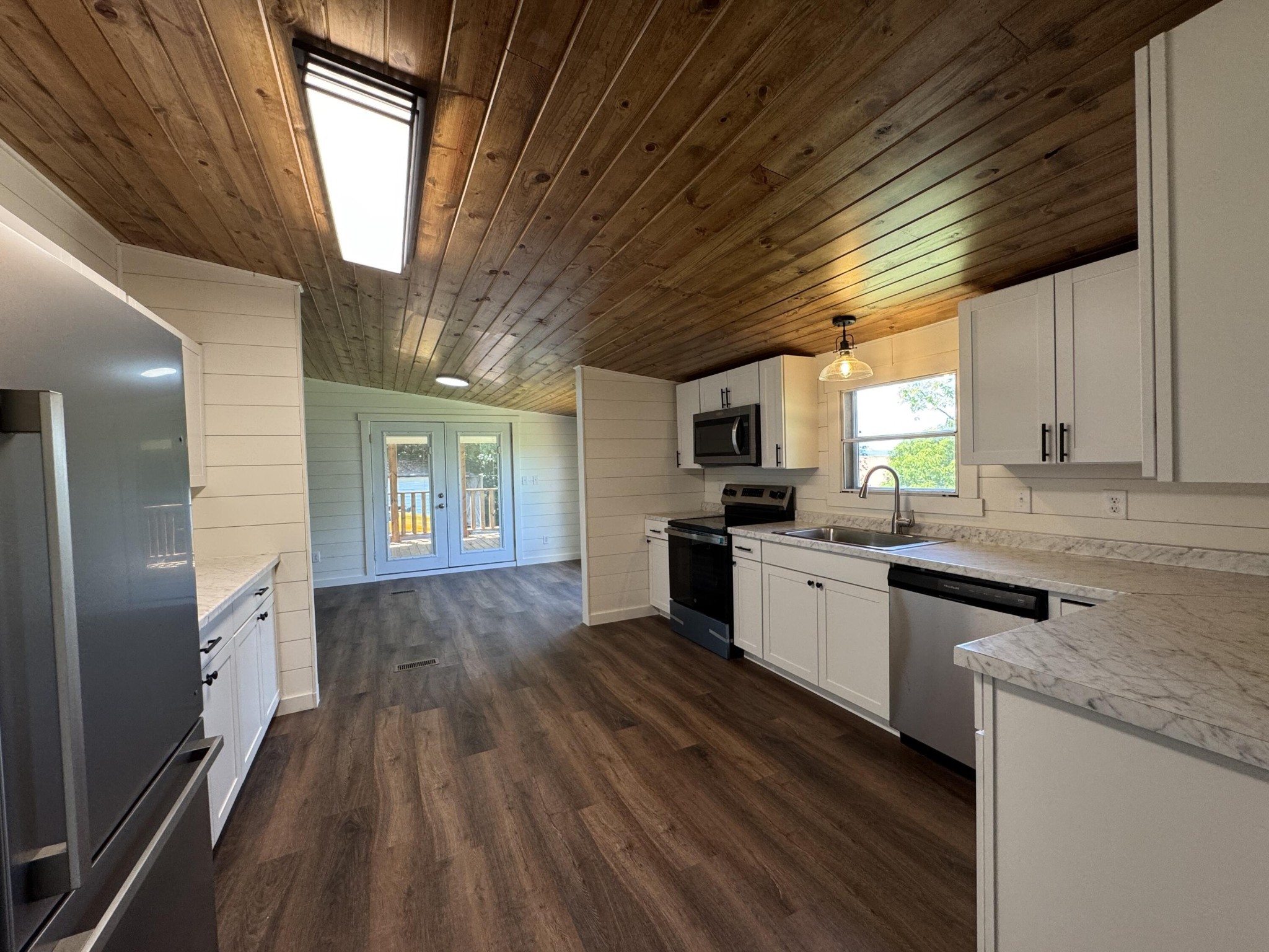 675 Ware Lane Georgetown, TN 37336 - Photo 10 of 24 a large kitchen with cabinets wooden floor and stainless steel appliances