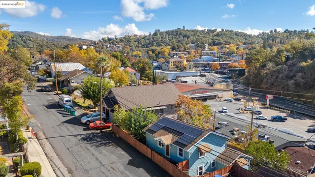a view of a house with a backyard