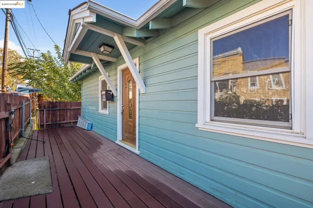 a view of wooden door with a house