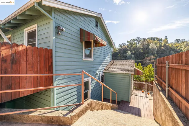 a patio with yard glass top table and chairs