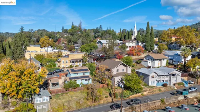 a living room filled with furniture and a window