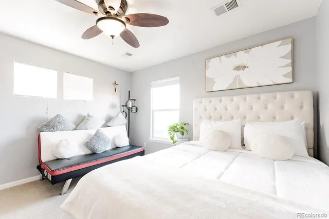 a bedroom with bed and window