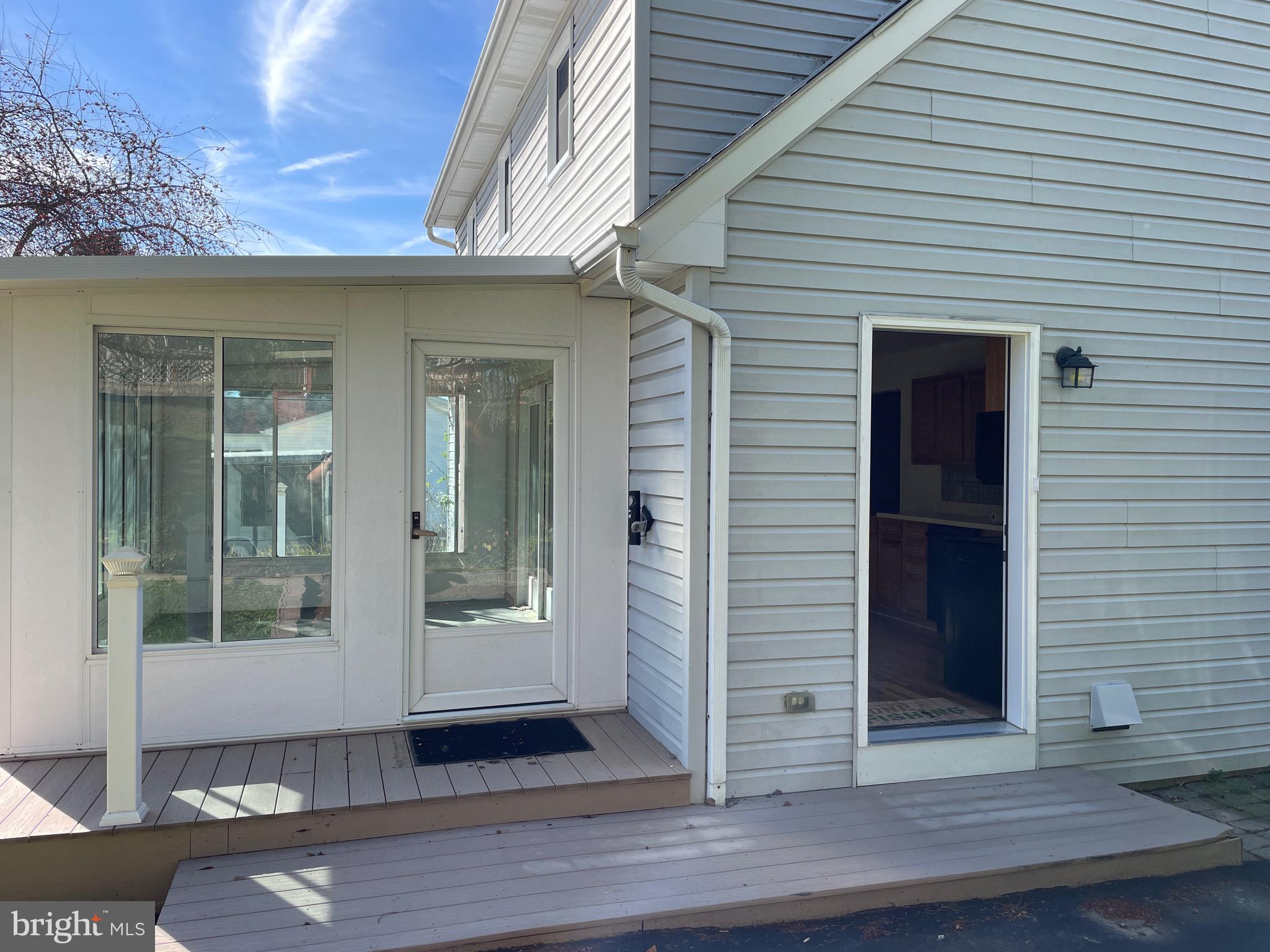 92 Oak Bottom Road Quarryville, PA 17566 - Photo 4 of 29 Kitchen and sunporch entry