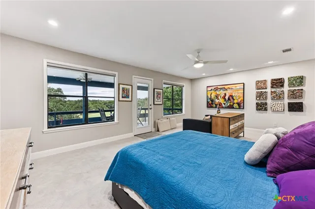 a bed room with a bed and a large window