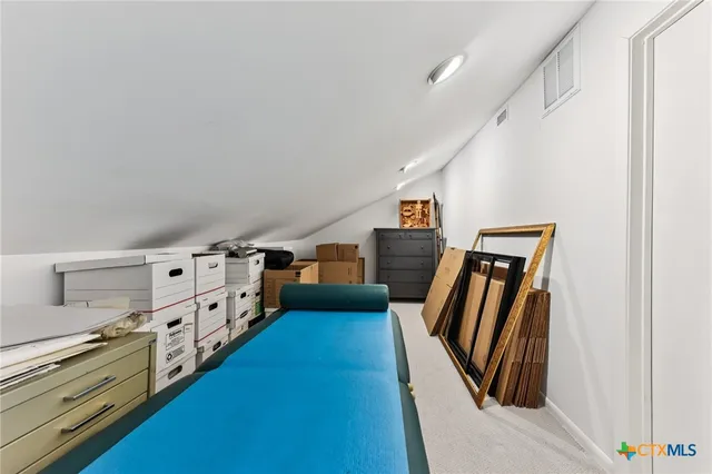 a view of a hallway with stairs