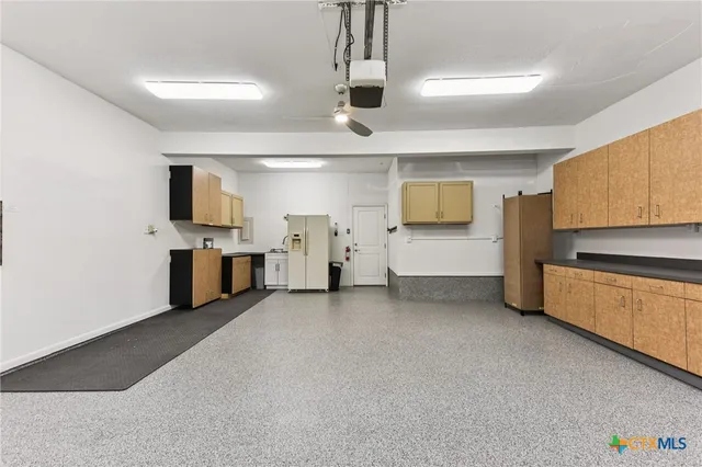 a view of a kitchen with sink and cabinet