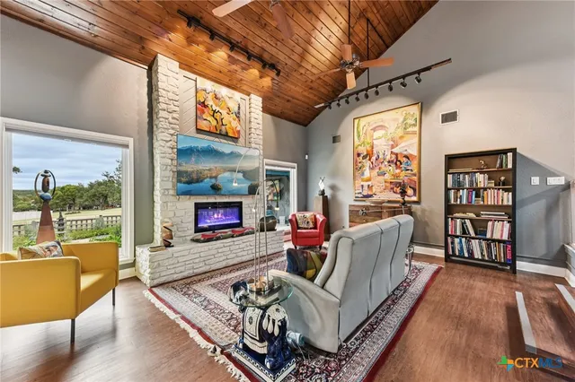 a living room with furniture and a fireplace