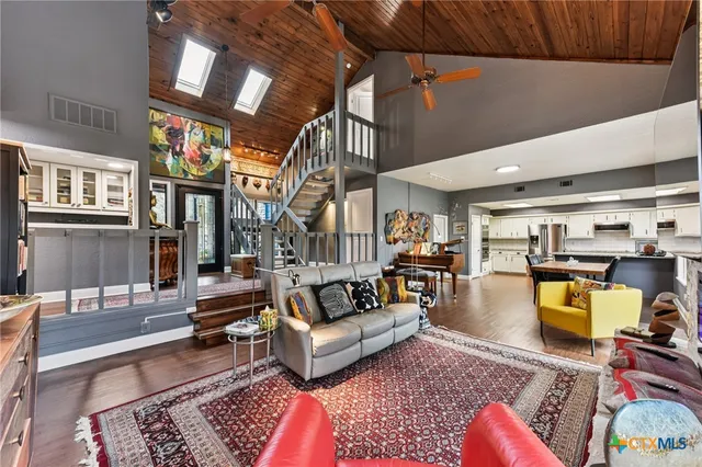 a living room with furniture and a rug