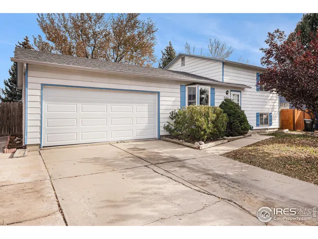 a view of house and garage