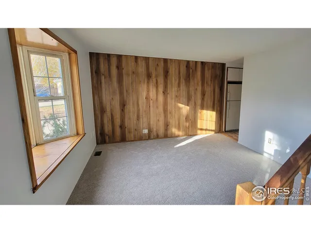 a open hall with furniture and a window