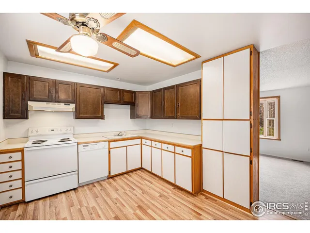 a kitchen with stainless steel appliances granite countertop a sink and cabinets