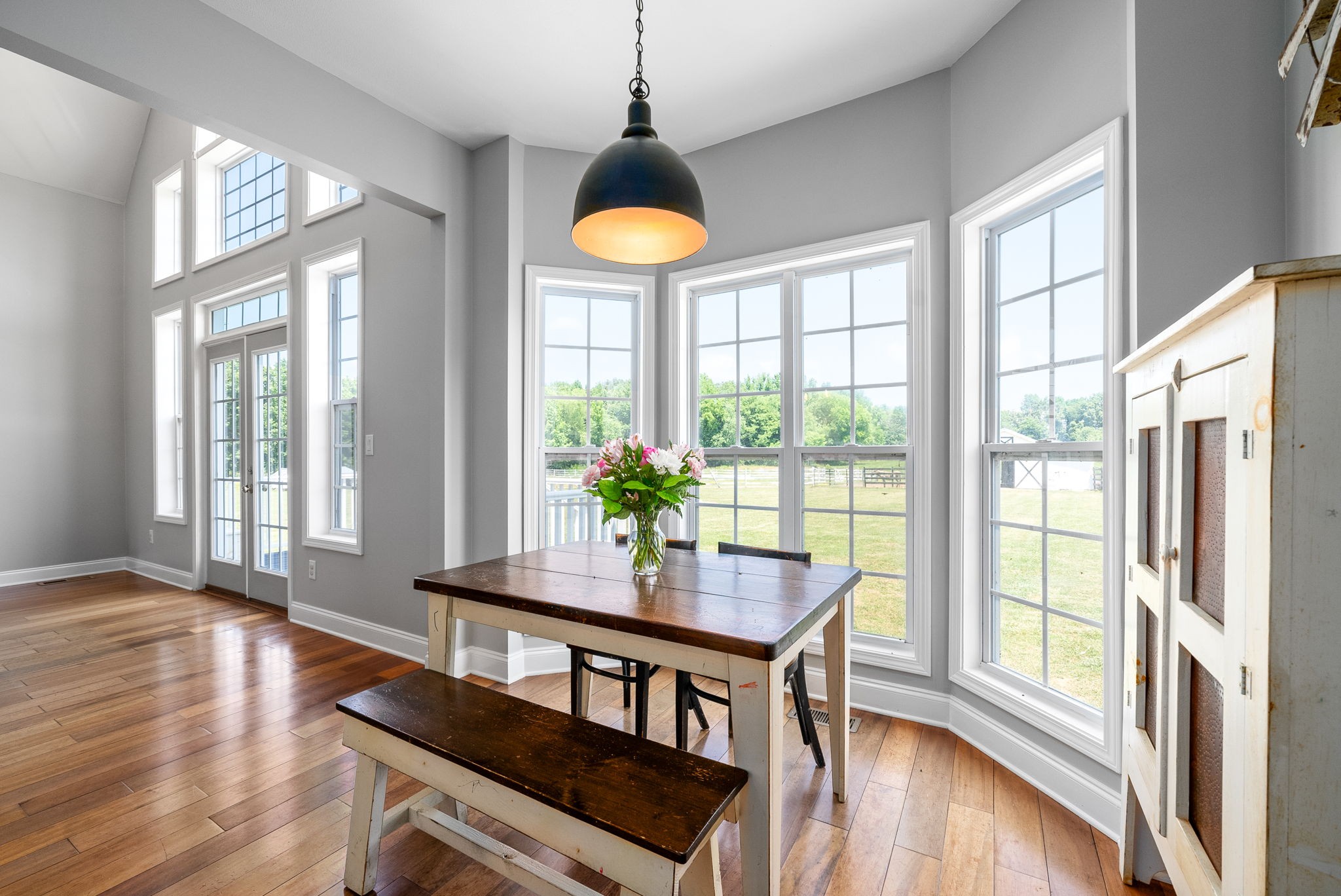 4555 Pineywoods Road Adams, TN 37010 - Photo 13 of 55 a view of a dining room with furniture window and wooden floor