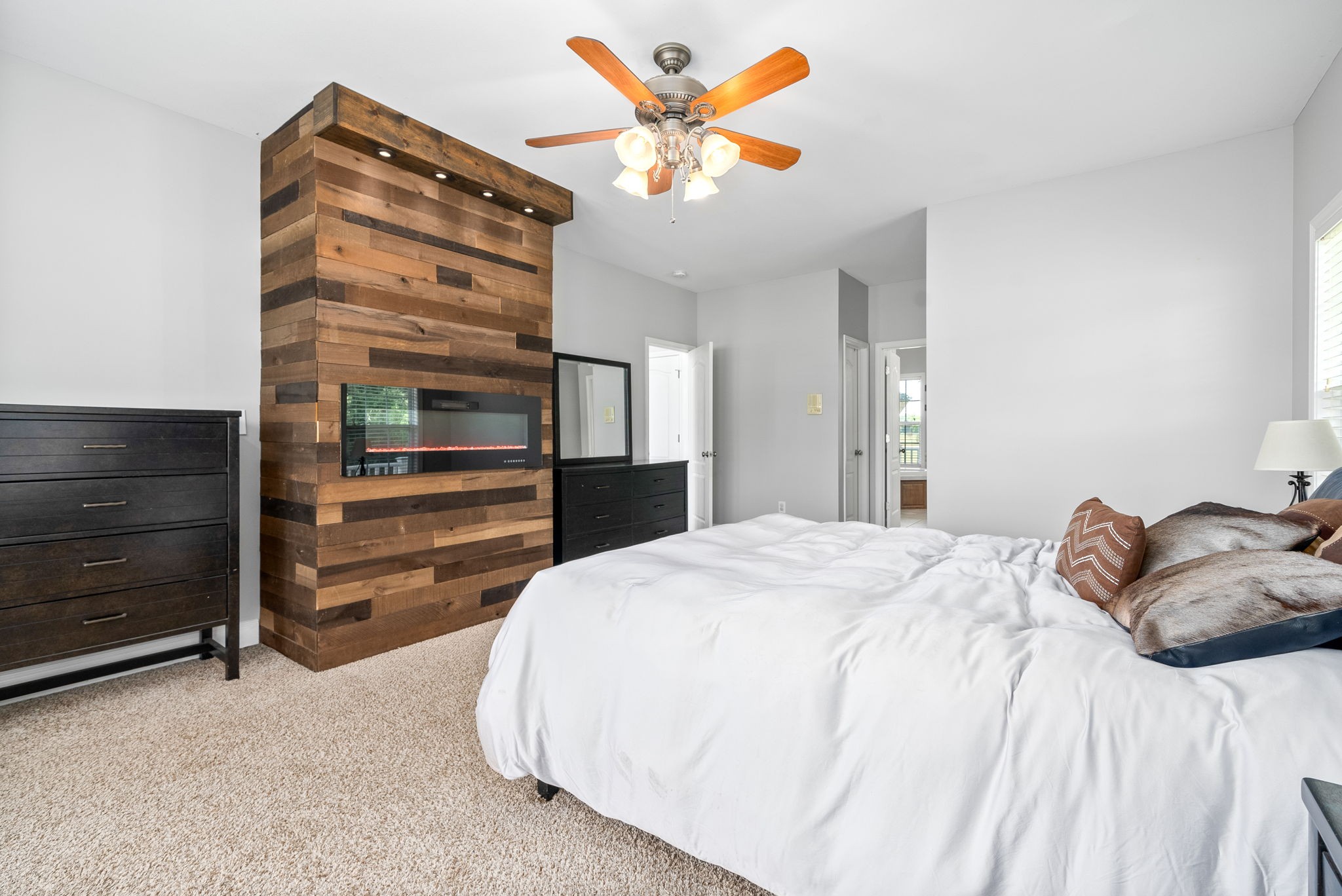 4555 Pineywoods Road Adams, TN 37010 - Photo 22 of 55 a bedroom with a bed and a chandelier