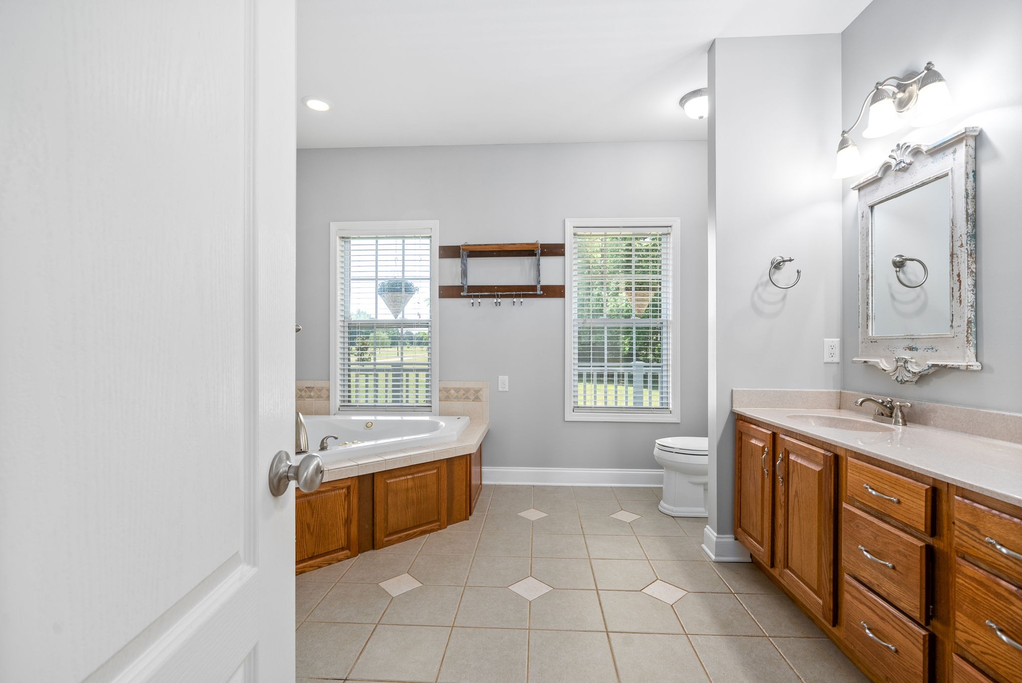 4555 Pineywoods Road Adams, TN 37010 - Photo 23 of 55 a spacious bathroom with a tub sink and mirror