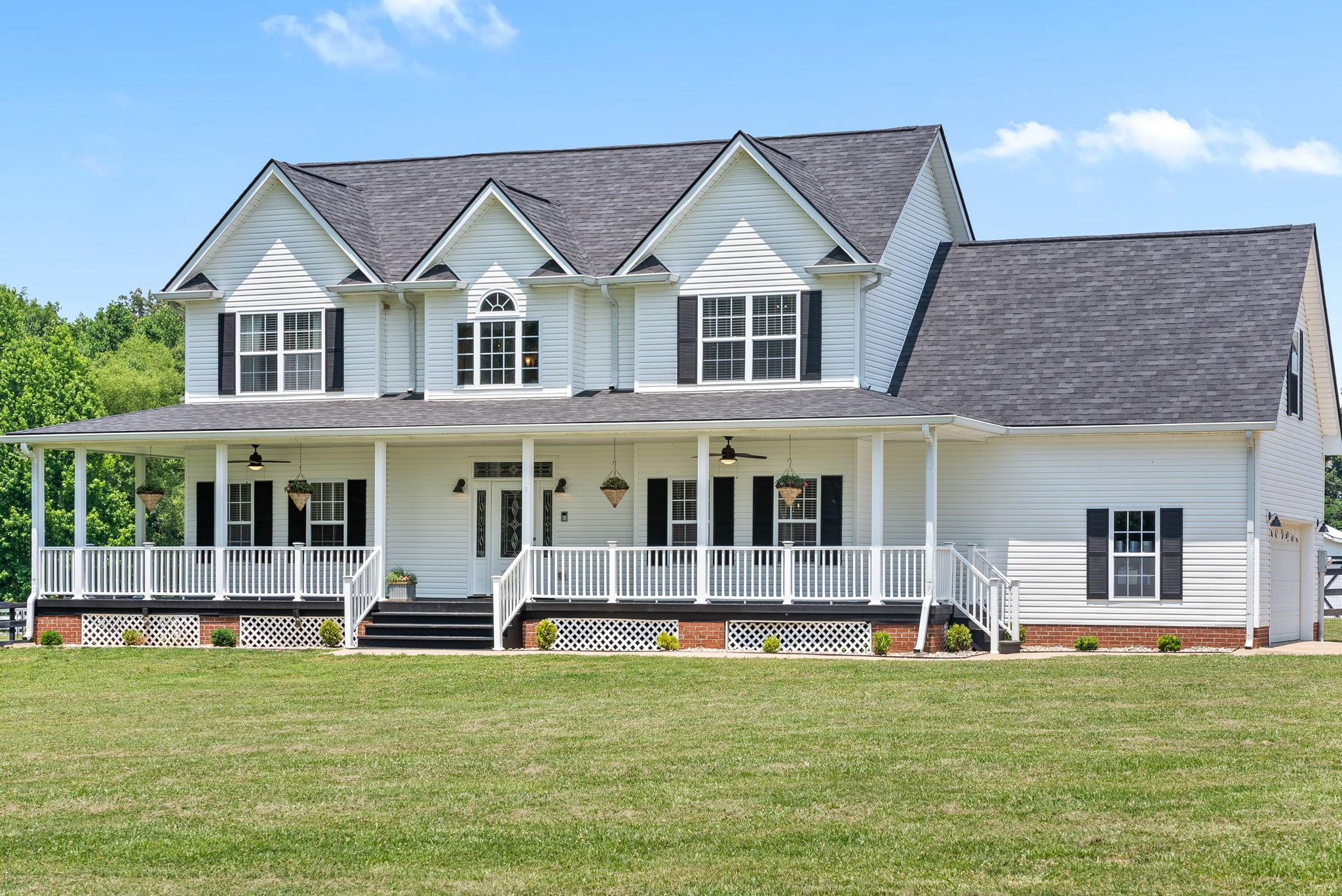 4555 Pineywoods Road Adams, TN 37010 - Photo 3 of 55 a front view of a house with a yard table and chairs