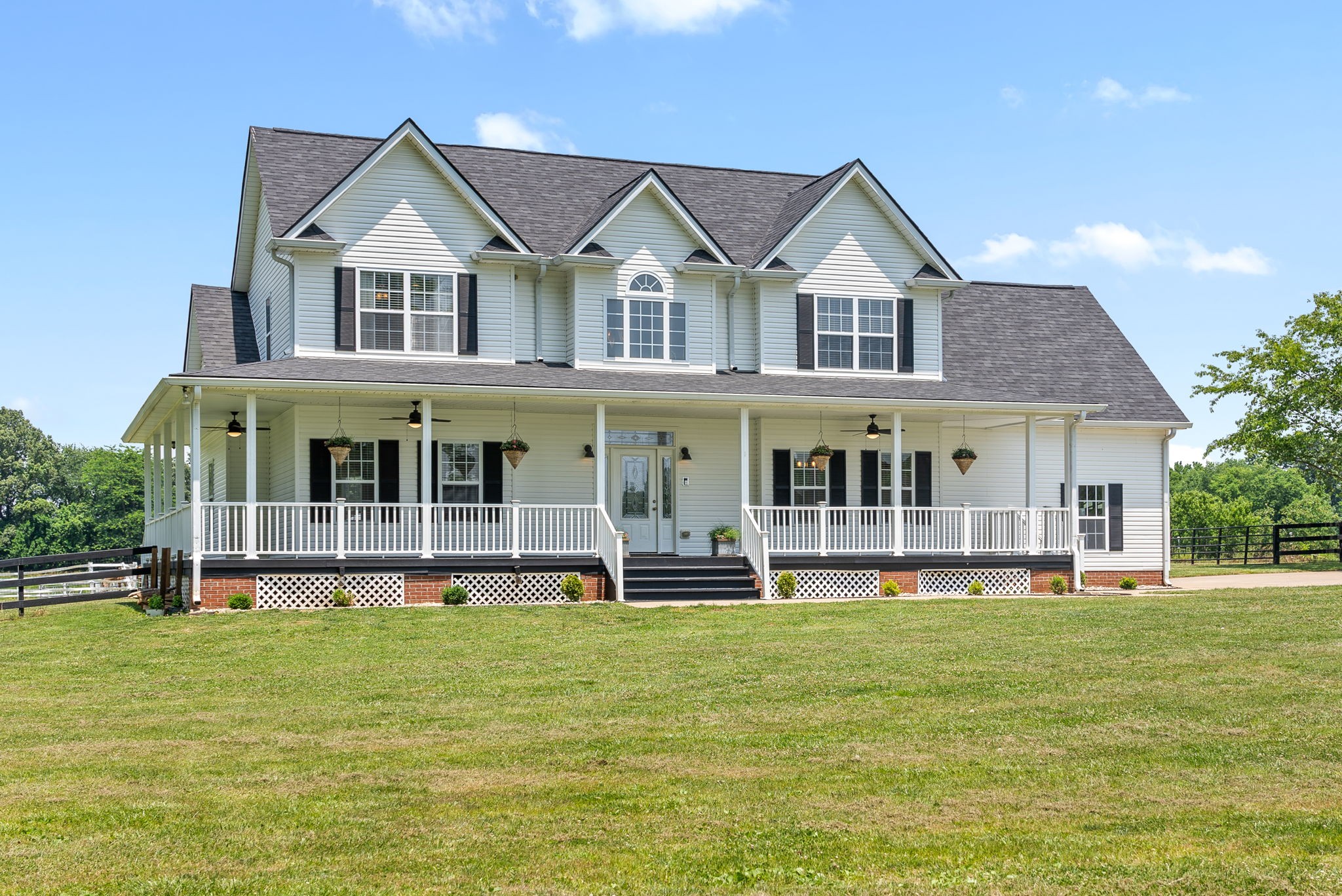 4555 Pineywoods Road Adams, TN 37010 - Photo 53 of 55 a front view of a house with a yard table and chairs