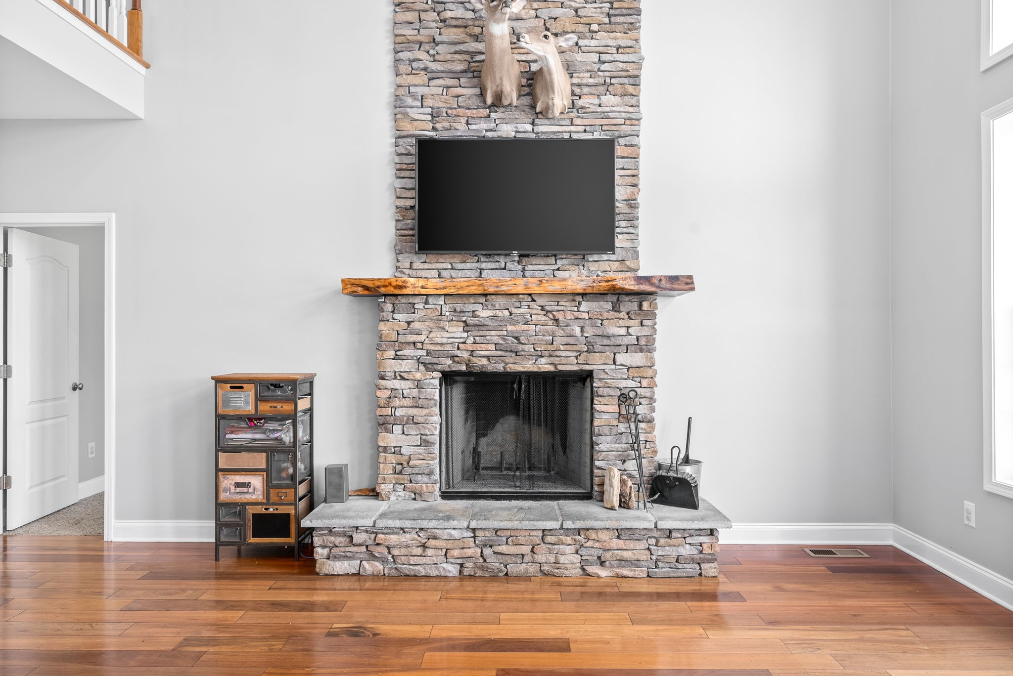4555 Pineywoods Road Adams, TN 37010 - Photo 9 of 55 a living room with a fireplace and a flat screen tv