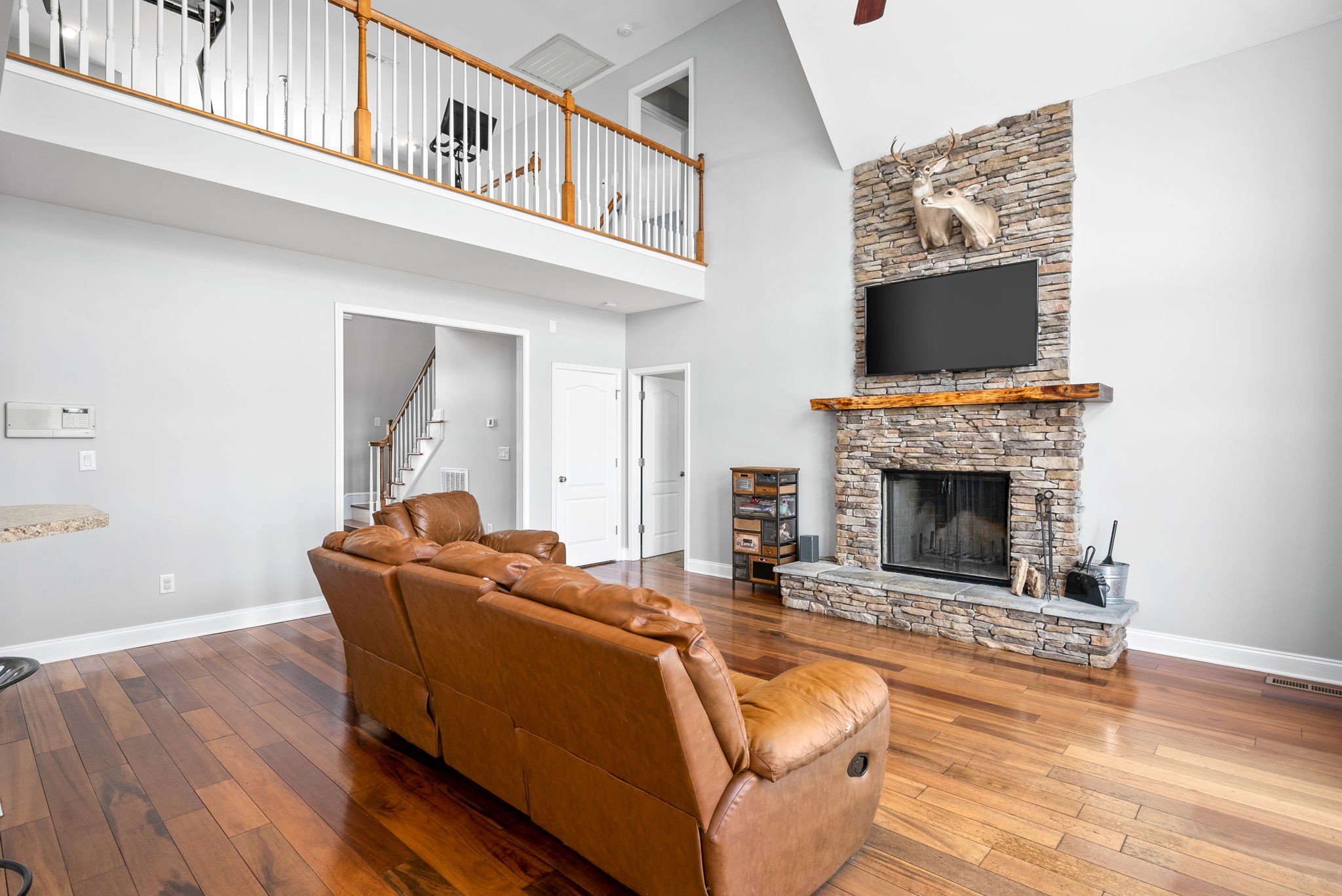 4555 Pineywoods Road Adams, TN 37010 - Photo 10 of 55 a living room with furniture a flat screen tv and a fireplace