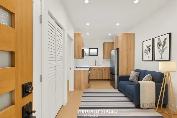 a living room with furniture and a rug