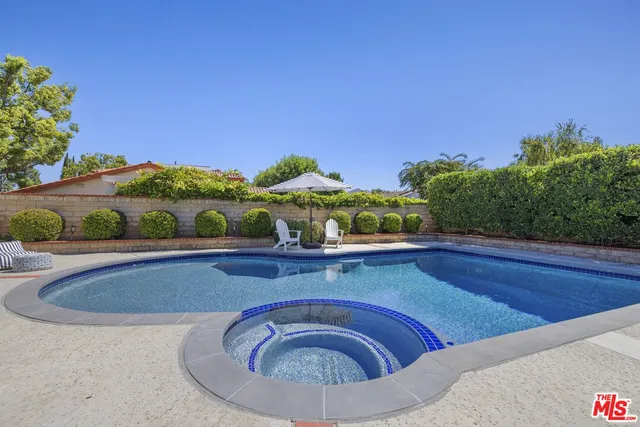 a view of swimming pool from a balcony