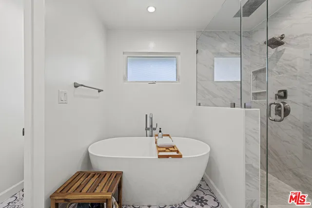 a bathroom with a sink and a shower