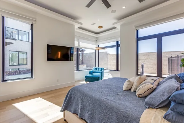 a spacious bathroom with a double vanity sink mirror and bathtub
