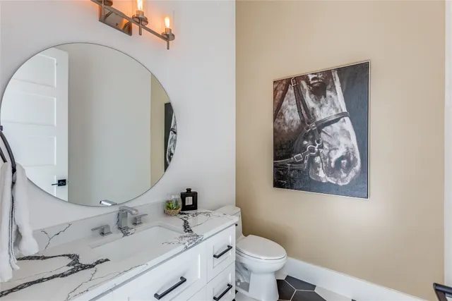 a bedroom with furniture and a flat screen tv