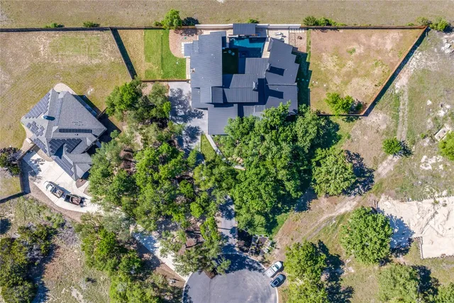 a view of a patio with a table and chairs