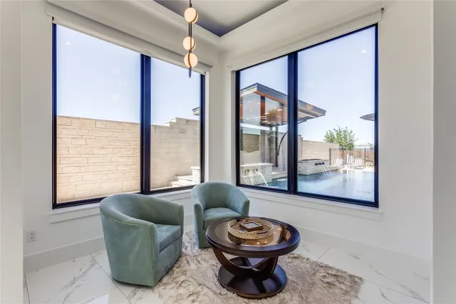 a backyard of a house with table and chairs