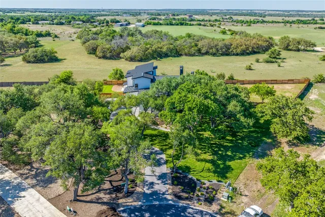 an aerial view of a house with garden space and outdoor space