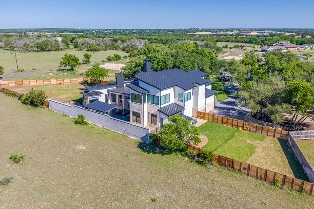 an aerial view of ocean with residential house with lake view