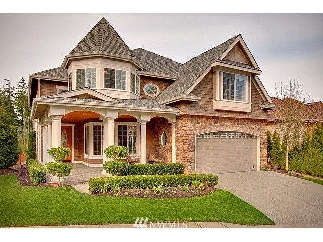 5370 Northeast 17th Street Renton, WA 98059 - Photo 1 of 25 a front view of a house with a yard