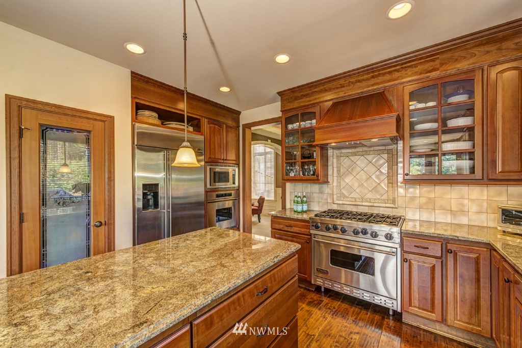 5370 Northeast 17th Street Renton, WA 98059 - Photo 6 of 25 a kitchen with stainless steel appliances granite countertop a stove and a refrigerator