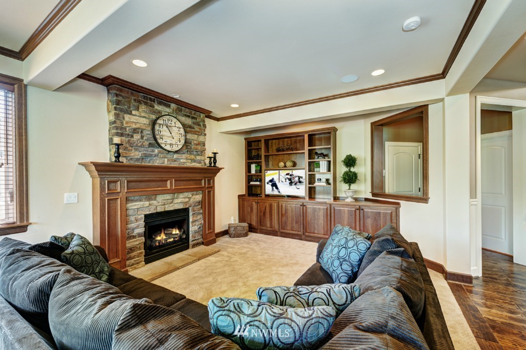 5370 Northeast 17th Street Renton, WA 98059 - Photo 8 of 25 a living room with furniture and a fireplace