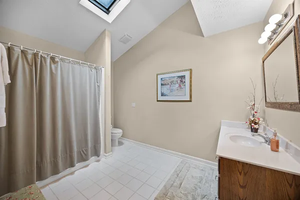 a bathroom with a sink vanity and a mirror