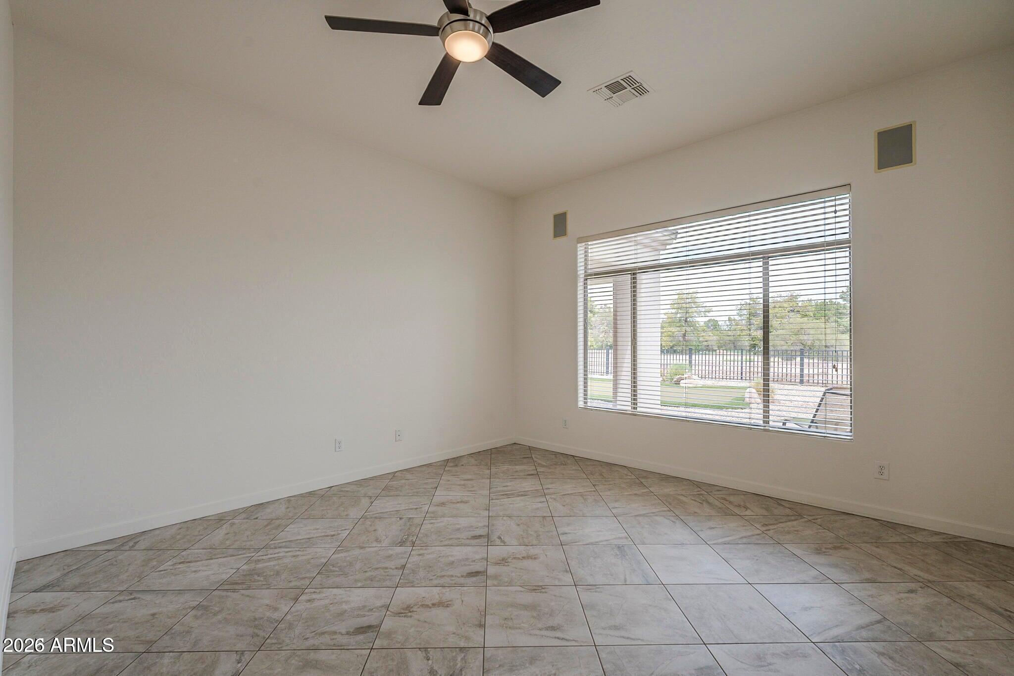 3910 East Carson Road Phoenix, AZ 85042 - Photo 12 of 19 a view of an empty room with a window
