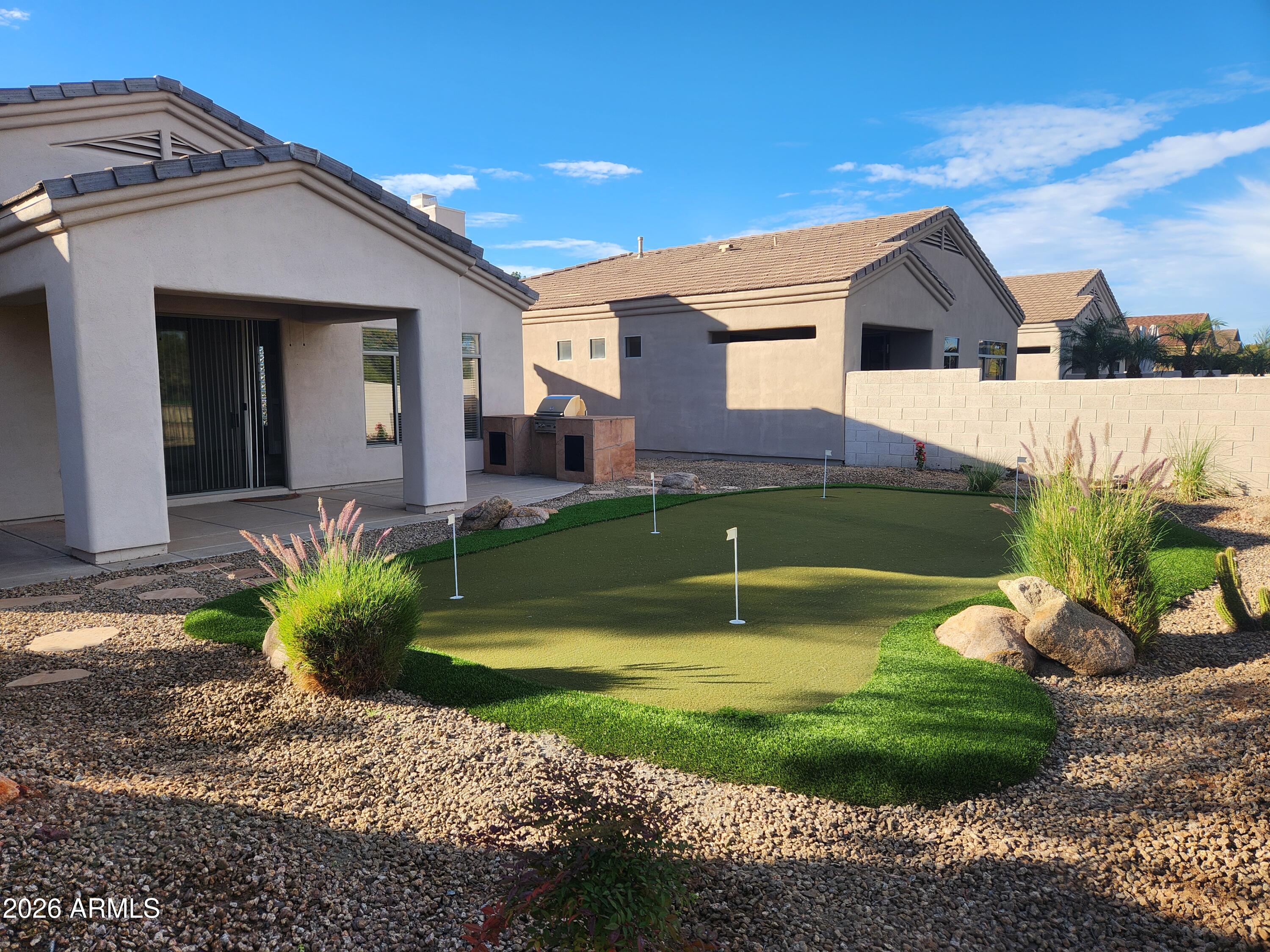 3910 East Carson Road Phoenix, AZ 85042 - Photo 18 of 19 a view of a house with backyard