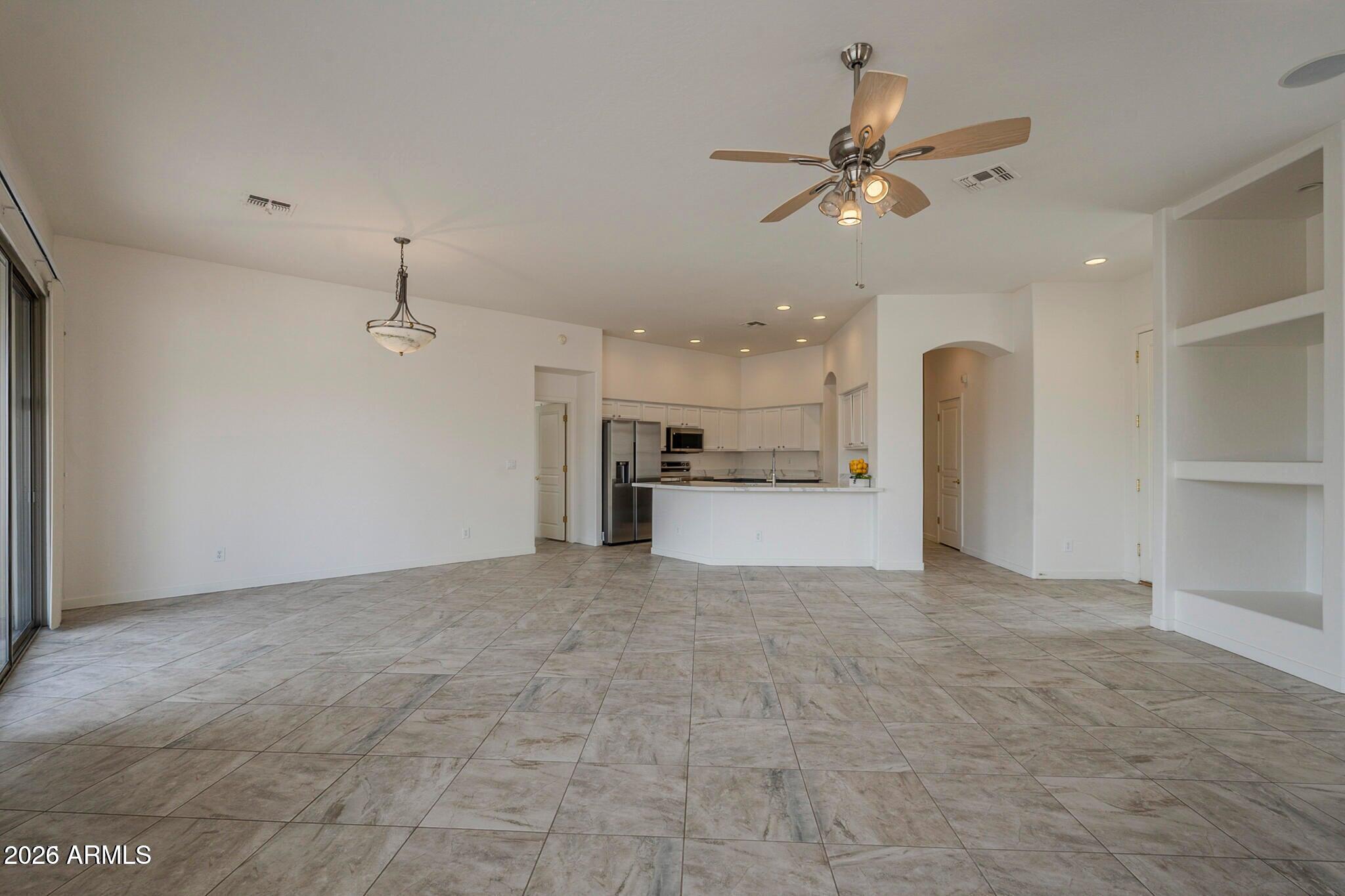 3910 East Carson Road Phoenix, AZ 85042 - Photo 4 of 19 a view of a kitchen with a sink and a refrigerator