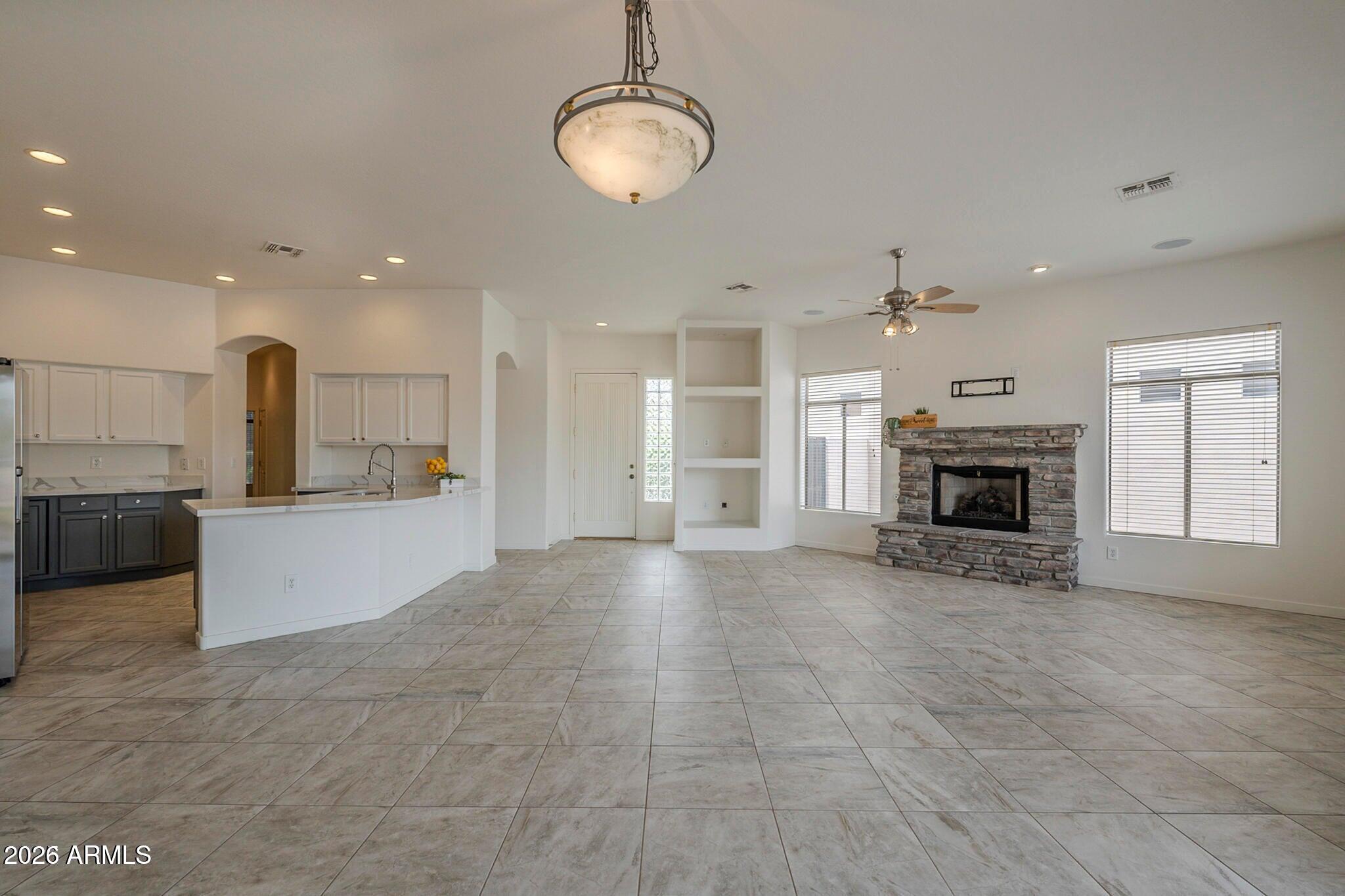 3910 East Carson Road Phoenix, AZ 85042 - Photo 5 of 19 a view of a kitchen with a stove cabinets and a kitchen