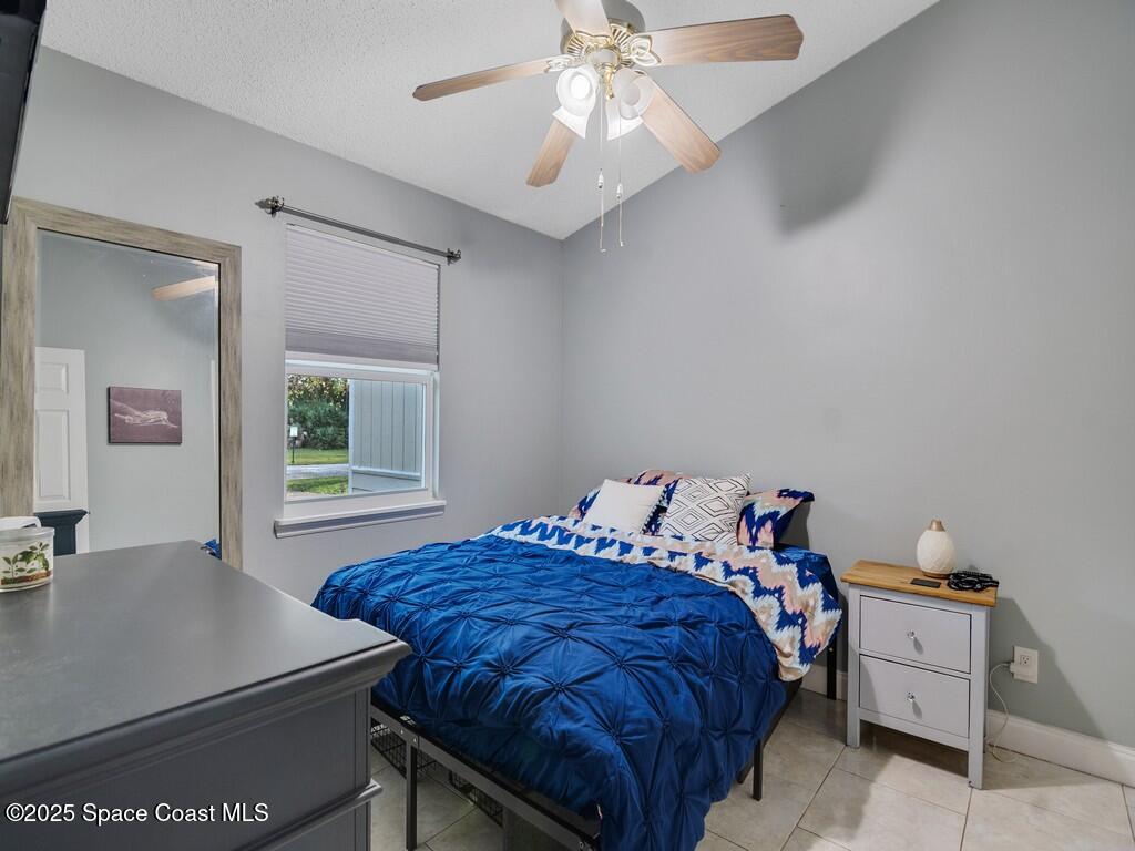 2020 Vero S Circle Southwest, Unit 4 Vero Beach, FL 32962 - Photo 14 of 33 a bedroom with a bed and a table