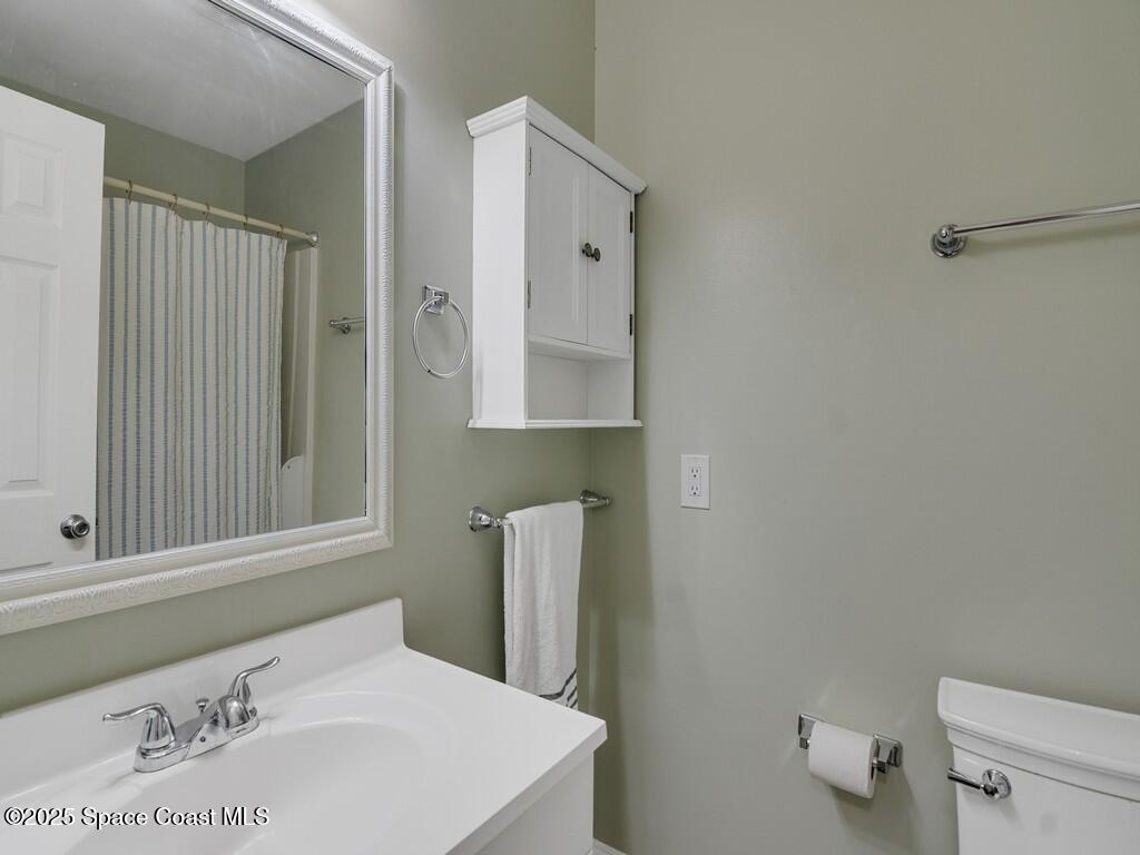 2020 Vero S Circle Southwest, Unit 4 Vero Beach, FL 32962 - Photo 15 of 33 a bathroom with a sink vanity and toilet