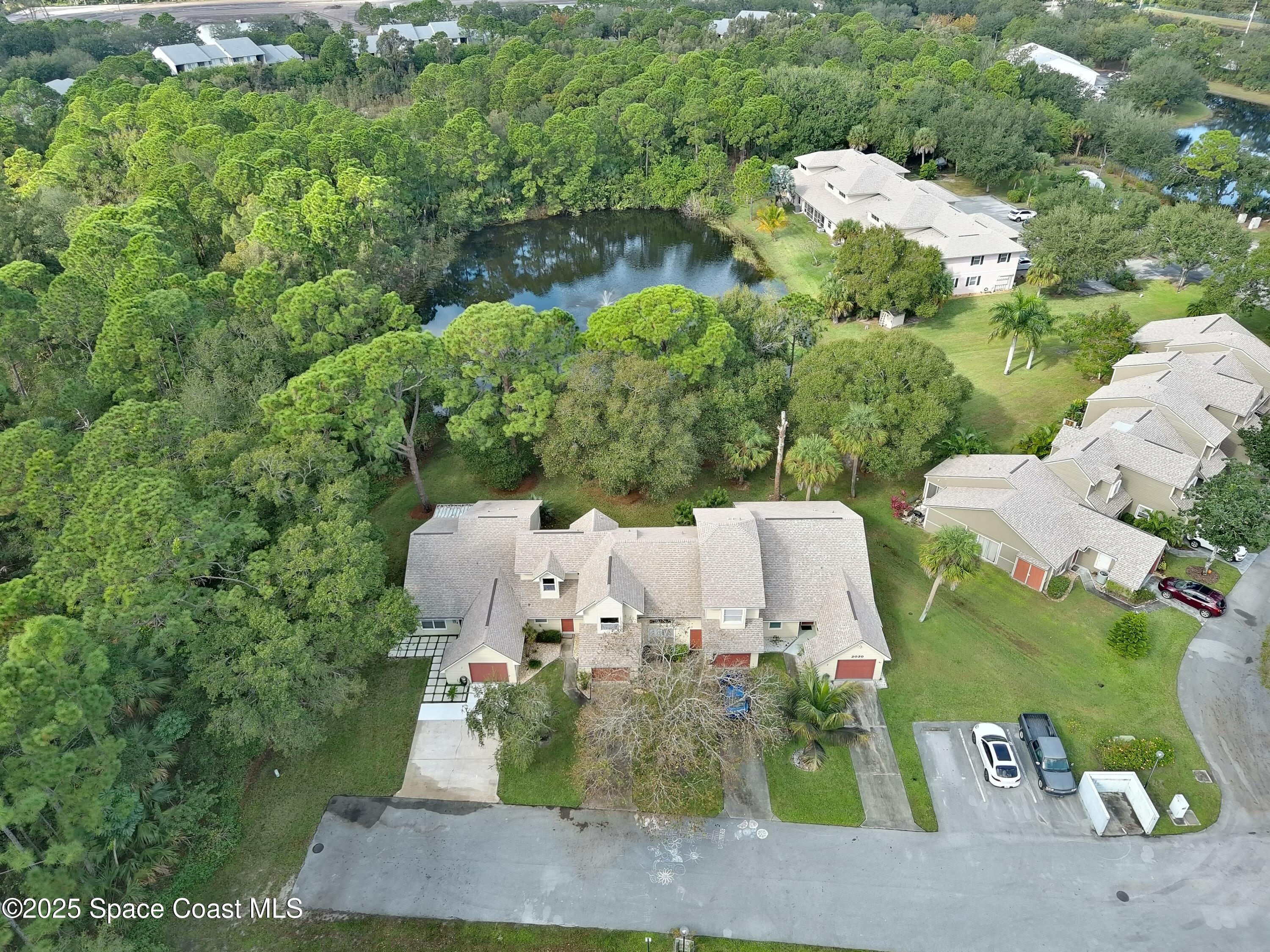 2020 Vero S Circle Southwest, Unit 4 Vero Beach, FL 32962 - Photo 17 of 33 an aerial view of a house with yard