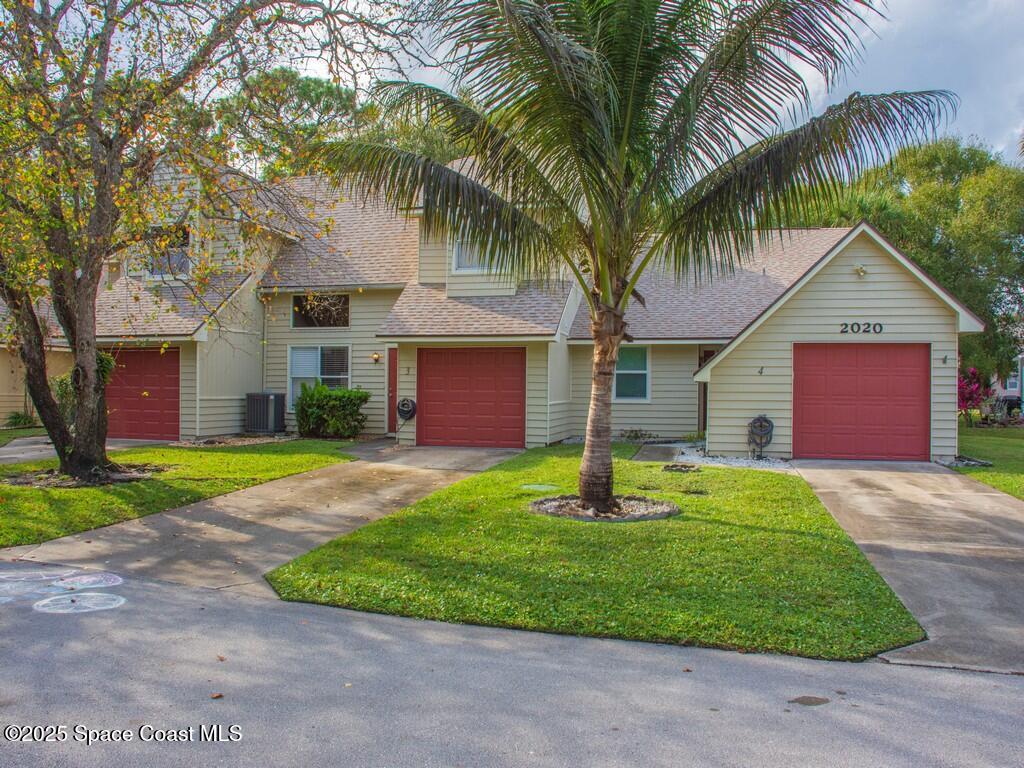 2020 Vero S Circle Southwest, Unit 4 Vero Beach, FL 32962 - Photo 21 of 33 a front view of house with yard and green space