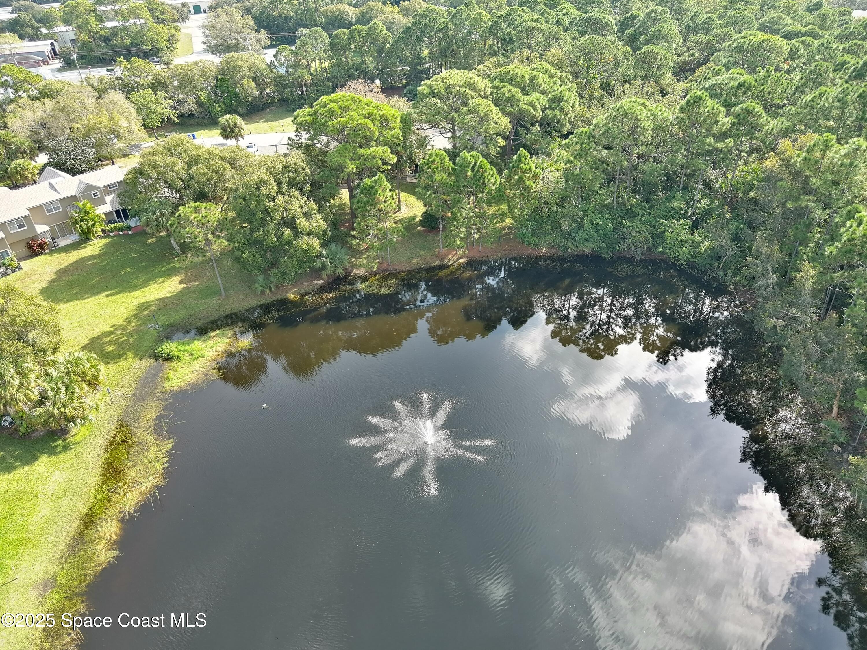 2020 Vero S Circle Southwest, Unit 4 Vero Beach, FL 32962 - Photo 28 of 33 a view of a lake from a yard