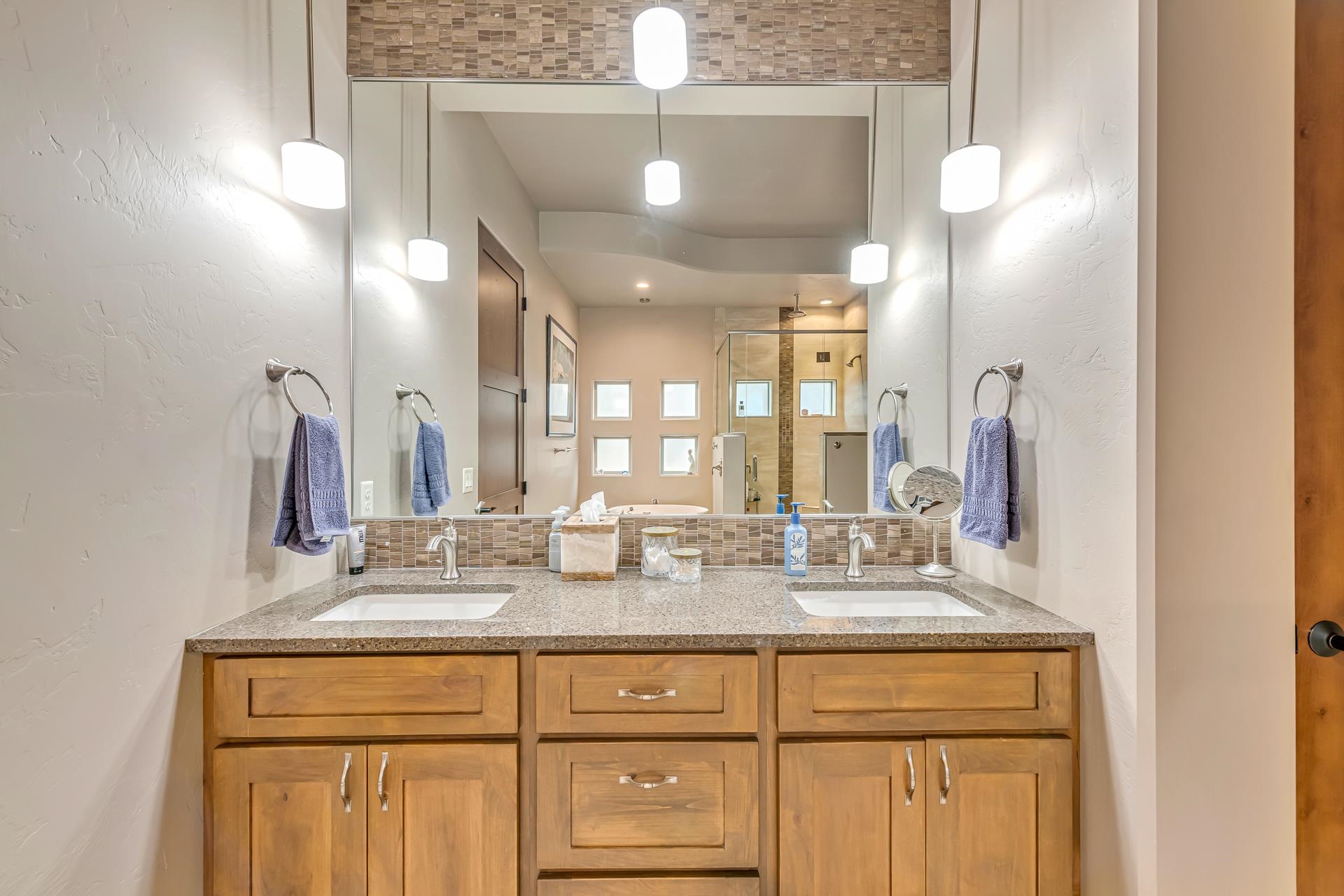 355 West Ridges Boulevard Grand Junction, CO 81507 - Photo 15 of 42 a bathroom with a double vanity sink and a mirror