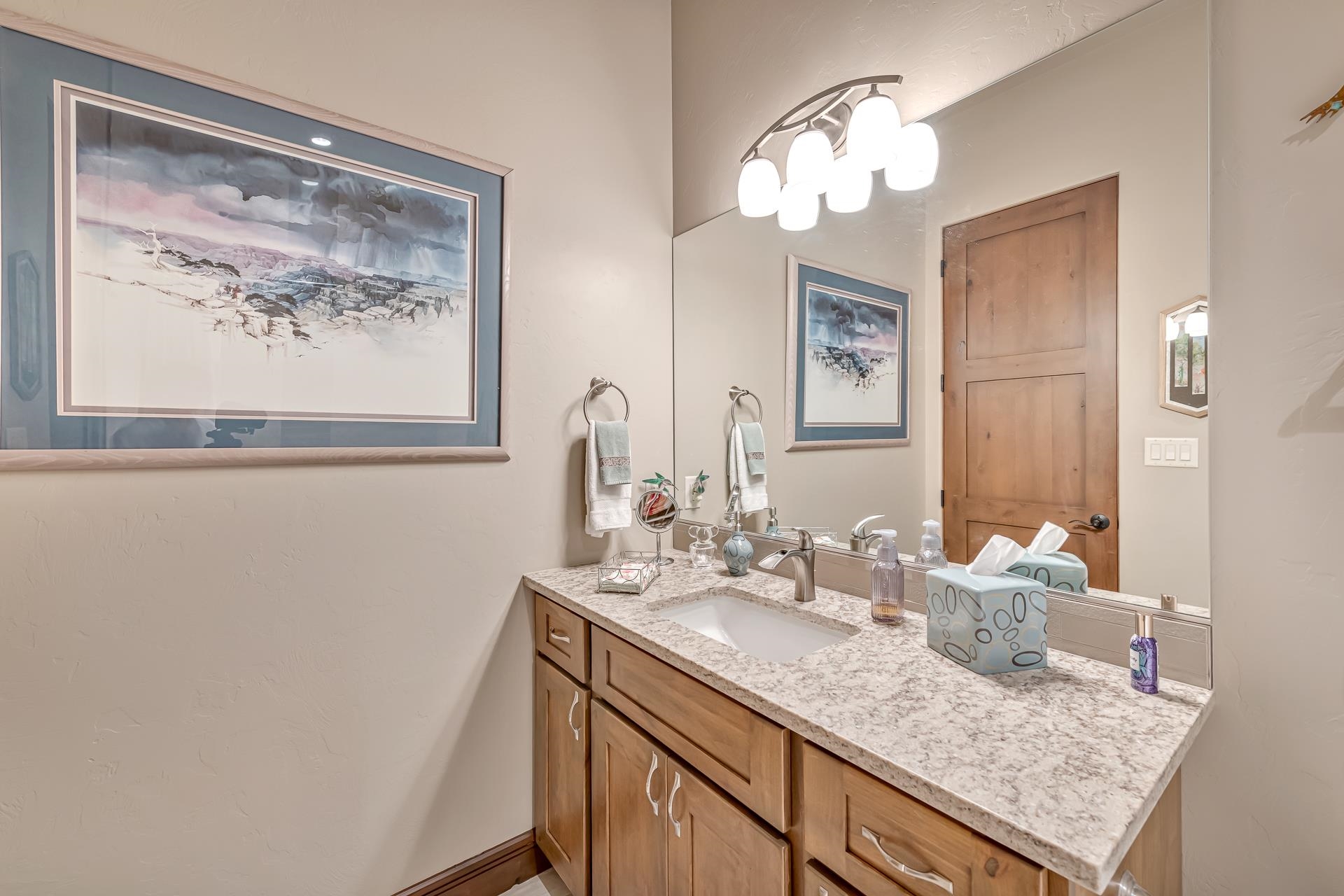 355 West Ridges Boulevard Grand Junction, CO 81507 - Photo 21 of 42 a bathroom with a sink vanity and a mirror